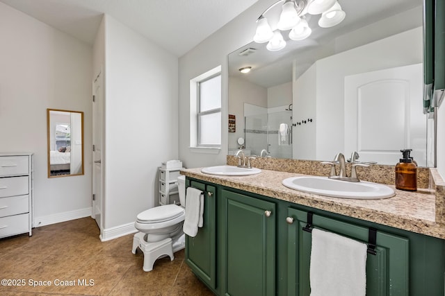 full bath with visible vents, a sink, a shower stall, and double vanity
