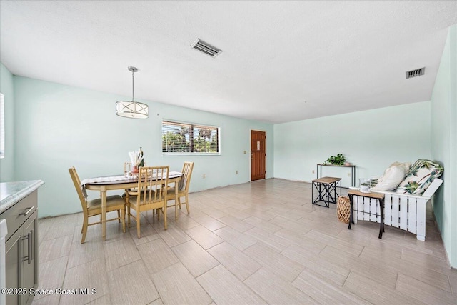 dining area featuring visible vents