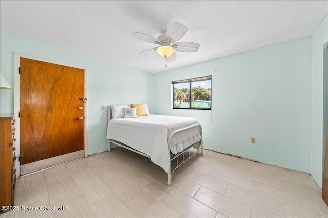 bedroom featuring a ceiling fan and light floors