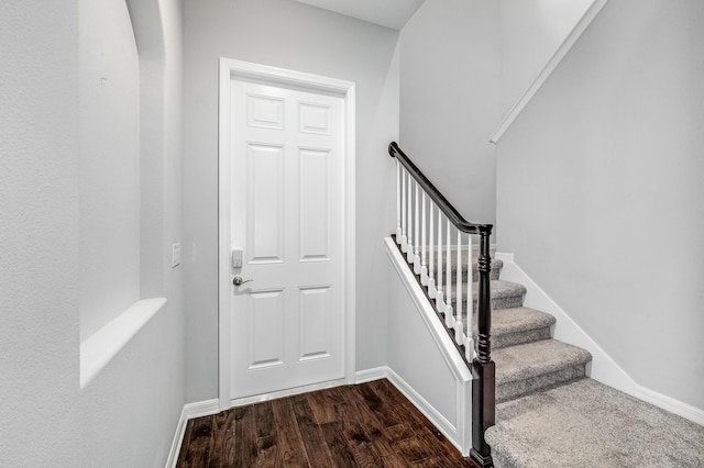 8850 Napolo Dr, Melbourne, FL 32940 - staircase featuring baseboards and wood finished floors