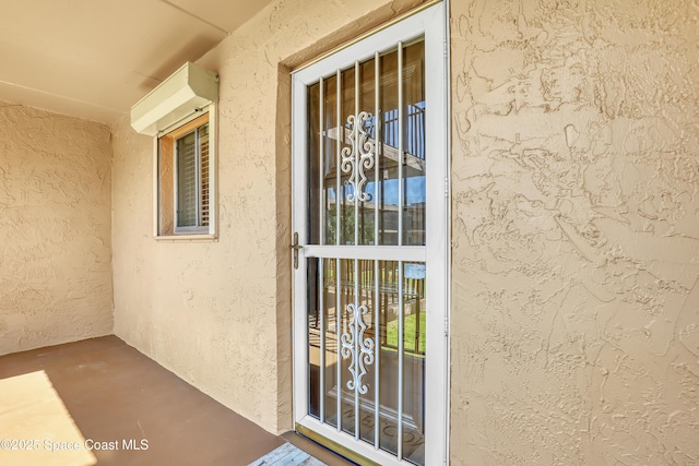 3150 N Harbor City Blvd Unit 236, Melbourne, FL 32935 - doorway to property featuring stucco siding