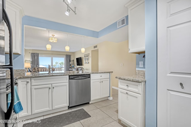 3150 N Harbor City Blvd Unit 236, Melbourne, FL 32935 - kitchen featuring light tile patterned floors, a peninsula, visible vents, dishwasher, and a sink