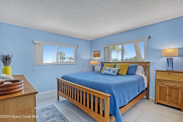 3150 N Harbor City Blvd Unit 236, Melbourne, FL 32935 - bedroom featuring baseboards and a textured ceiling