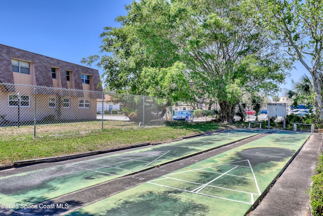 3150 N Harbor City Blvd Unit 236, Melbourne, FL 32935 - surrounding community featuring a yard, shuffleboard, and fence
