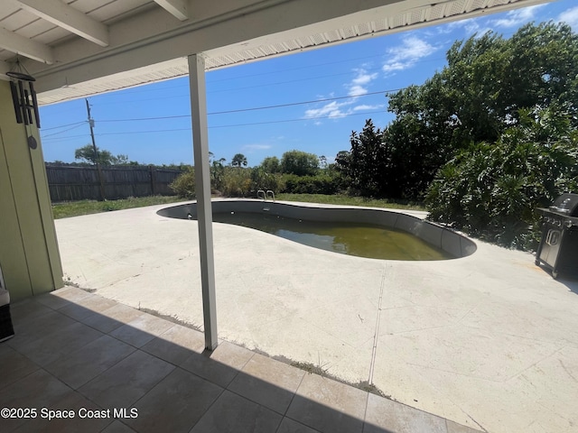 view of pool with a fenced in pool, a patio, and fence