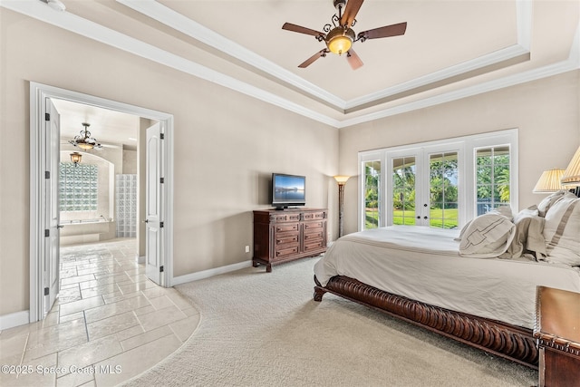 bedroom featuring french doors, baseboards, ornamental molding, stone tile flooring, and a tray ceiling