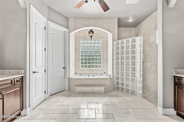 full bath featuring vanity, ceiling fan, walk in shower, and a bath