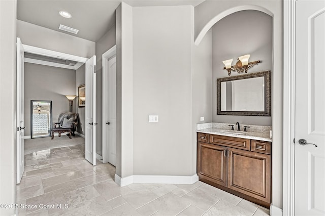 bathroom with baseboards and vanity