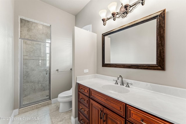 bathroom with toilet, a stall shower, vanity, and baseboards