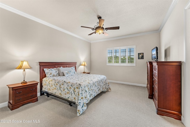 bedroom with crown molding, light colored carpet, baseboards, and ceiling fan