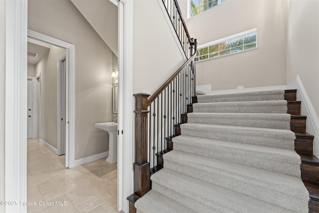 stairway featuring baseboards
