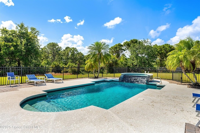 view of pool featuring a patio area, fence, and view of wooded area