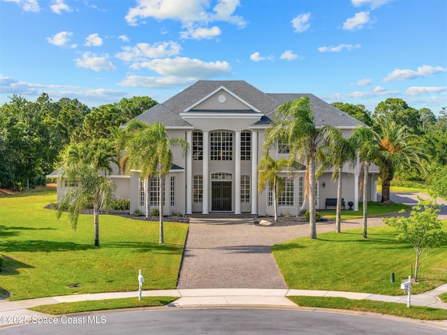 view of building exterior featuring decorative driveway