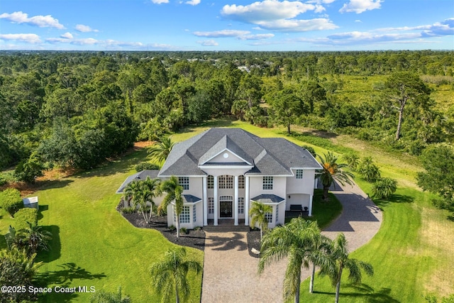 view from above of property featuring a forest