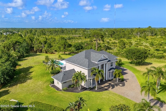 view from above of property with a forest