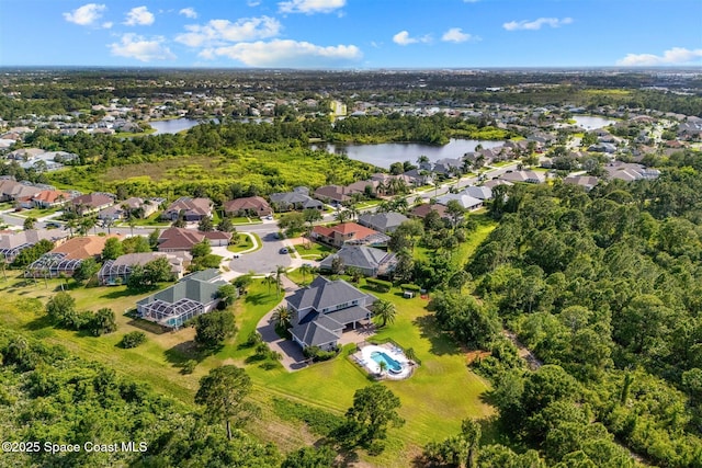 view of property location with a nearby body of water and nearby suburban area