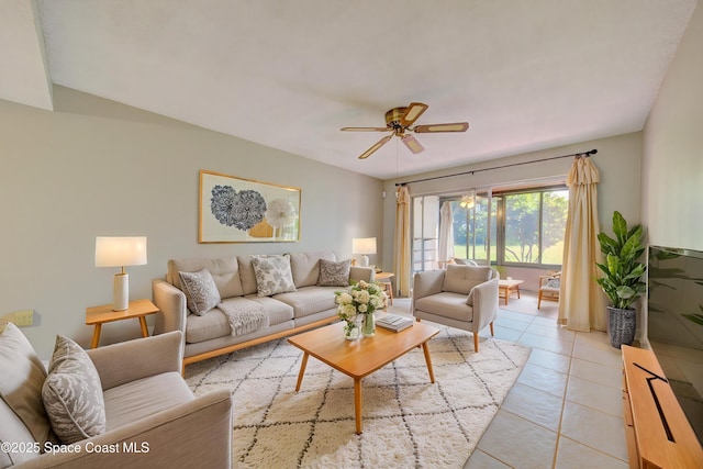 living room featuring light tile patterned floors and a ceiling fan