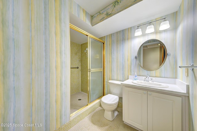 bathroom featuring a shower stall, tile patterned floors, wallpapered walls, and toilet