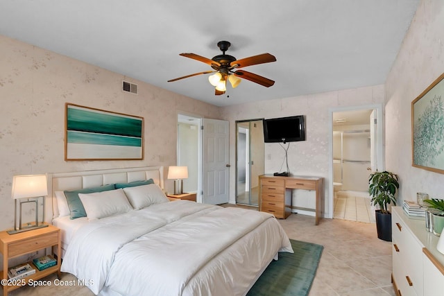 5801 N Banana River Blvd Unit 936, Cape Canaveral, FL 32920 - bedroom featuring light tile patterned flooring, visible vents, ceiling fan, and ensuite bathroom