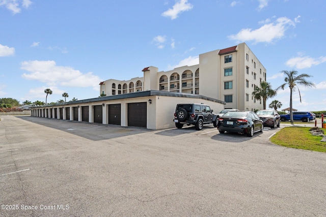 5801 N Banana River Blvd Unit 936, Cape Canaveral, FL 32920 - view of property featuring community garages and uncovered parking