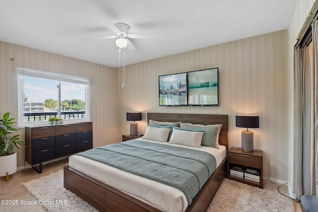 5801 N Banana River Blvd Unit 936, Cape Canaveral, FL 32920 - bedroom featuring ceiling fan, wallpapered walls, and baseboards