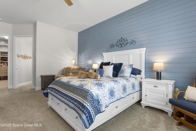 1954 Crossbill Dr, Titusville, FL 32796 - bedroom featuring ceiling fan, wood walls, baseboards, and carpet floors
