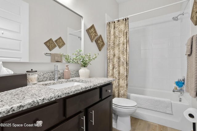 1954 Crossbill Dr, Titusville, FL 32796 - full bath with shower / bath combo with shower curtain, vanity, toilet, and wood finished floors