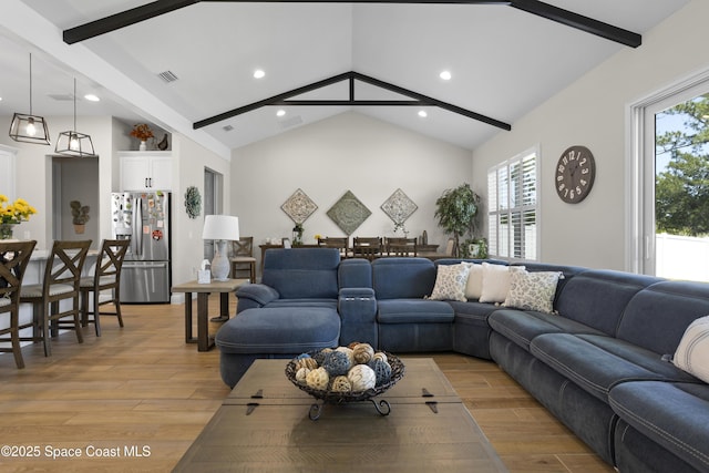 1954 Crossbill Dr, Titusville, FL 32796 - living room with recessed lighting, light wood-style flooring, visible vents, and beam ceiling