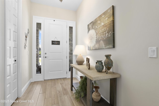 1954 Crossbill Dr, Titusville, FL 32796 - foyer with light wood-type flooring and baseboards
