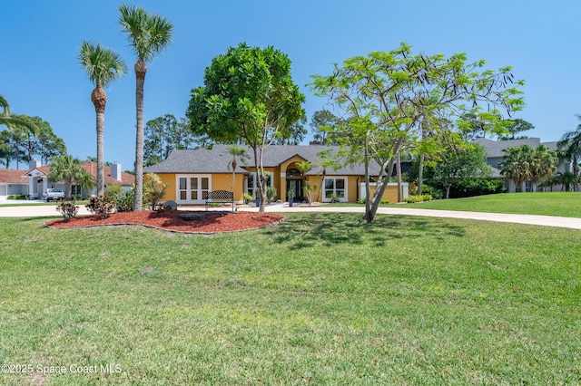 ranch-style house with stucco siding and a front yard
