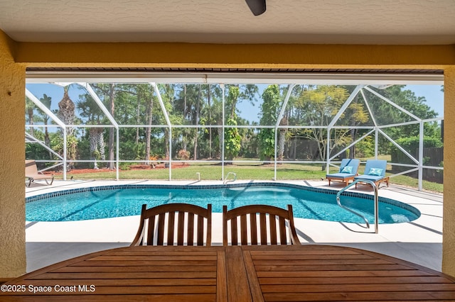 outdoor pool featuring a patio and a lanai