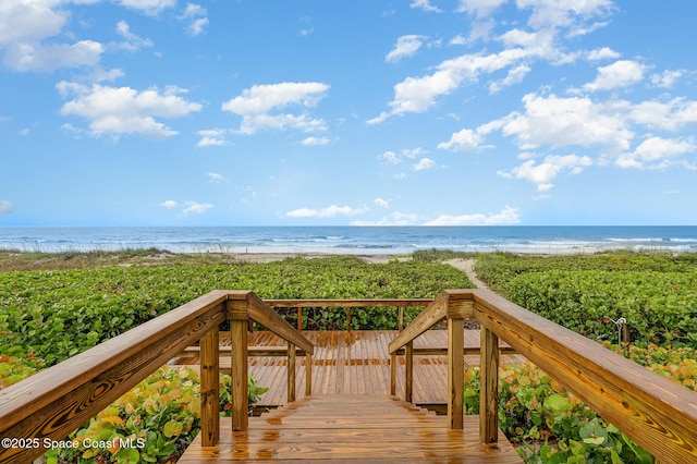 surrounding community with view of water and beach