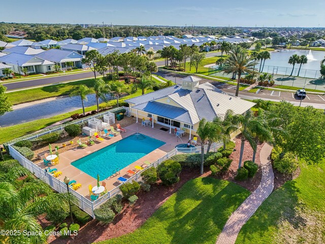 4040 Alamanda Key Dr, Melbourne, FL 32901 - aerial perspective of suburban area with a pool area and a large body of water
