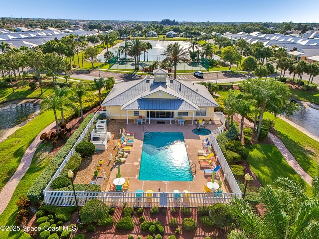4040 Alamanda Key Dr, Melbourne, FL 32901 - aerial perspective of suburban area featuring a pool and a large body of water