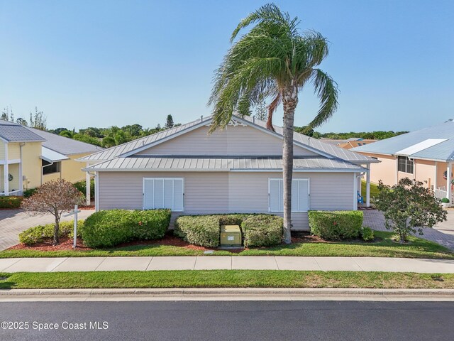 4040 Alamanda Key Dr, Melbourne, FL 32901 - view of front of property featuring metal roof