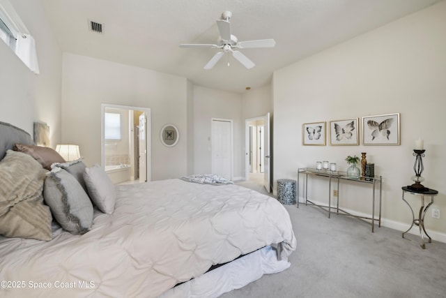 4040 Alamanda Key Dr, Melbourne, FL 32901 - carpeted bedroom with baseboards, ensuite bathroom, and ceiling fan