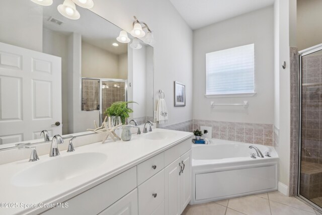 4040 Alamanda Key Dr, Melbourne, FL 32901 - full bath with tile patterned flooring, a shower stall, and a garden tub