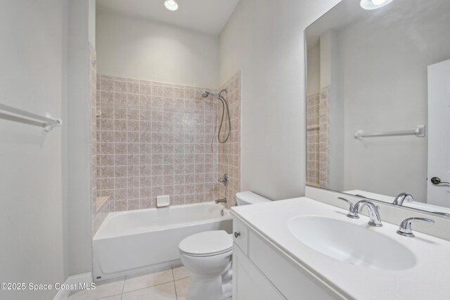 4040 Alamanda Key Dr, Melbourne, FL 32901 - full bathroom featuring tile patterned floors, toilet, vanity, and shower / bathtub combination