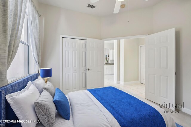 4040 Alamanda Key Dr, Melbourne, FL 32901 - bedroom featuring light tile patterned flooring, a closet, baseboards, and ceiling fan