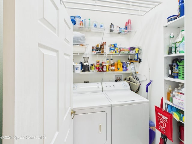 laundry area featuring separate washer and dryer and laundry area