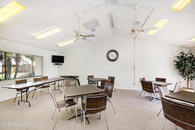 2245 Golf Isle Dr Unit 424, Melbourne, FL 32935 - dining area featuring lofted ceiling, carpet floors, a ceiling fan, and visible vents