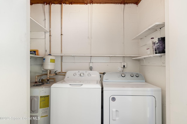 2245 Golf Isle Dr Unit 424, Melbourne, FL 32935 - clothes washing area with water heater, independent washer and dryer, and laundry area