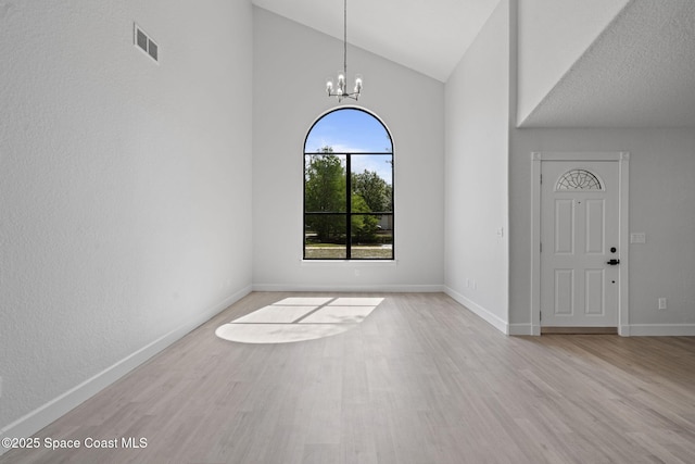 4000 Ocala St, Cocoa, FL 32926 - foyer entrance with baseboards, wood finished floors, and a chandelier