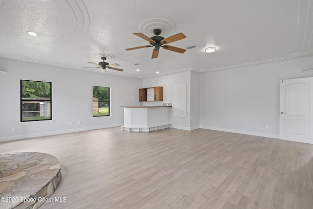 4000 Ocala St, Cocoa, FL 32926 - unfurnished living room featuring light wood-type flooring, a ceiling fan, visible vents, and a textured ceiling