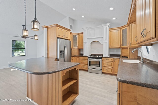 4000 Ocala St, Cocoa, FL 32926 - kitchen with lofted ceiling, dark countertops, a sink, and appliances with stainless steel finishes