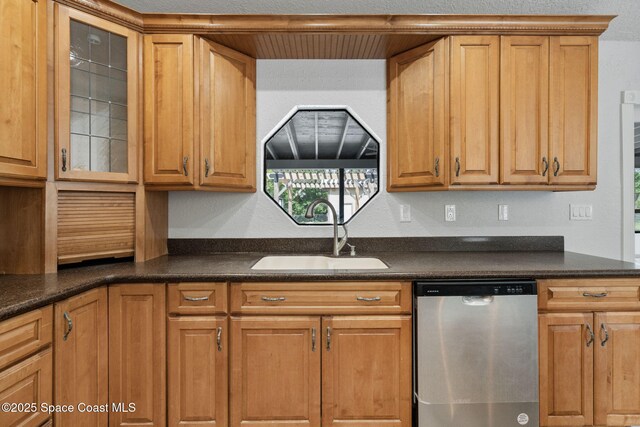 4000 Ocala St, Cocoa, FL 32926 - kitchen with dishwasher, dark countertops, and a sink