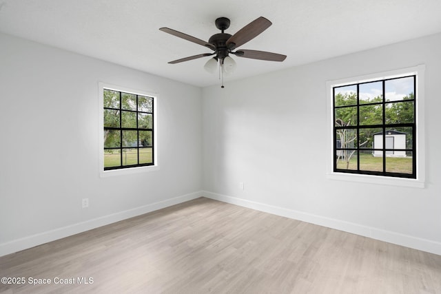 4000 Ocala St, Cocoa, FL 32926 - empty room featuring baseboards, a wealth of natural light, and light wood-type flooring