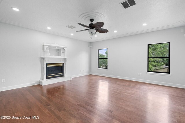 4000 Ocala St, Cocoa, FL 32926 - unfurnished living room with ceiling fan, a glass covered fireplace, wood finished floors, and visible vents