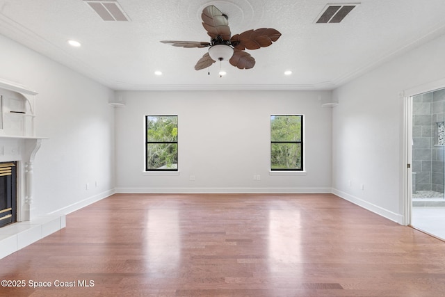 4000 Ocala St, Cocoa, FL 32926 - unfurnished living room featuring wood finished floors, visible vents, and a healthy amount of sunlight