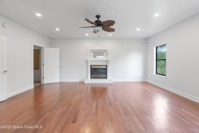 4000 Ocala St, Cocoa, FL 32926 - unfurnished living room with a glass covered fireplace, recessed lighting, and ceiling fan